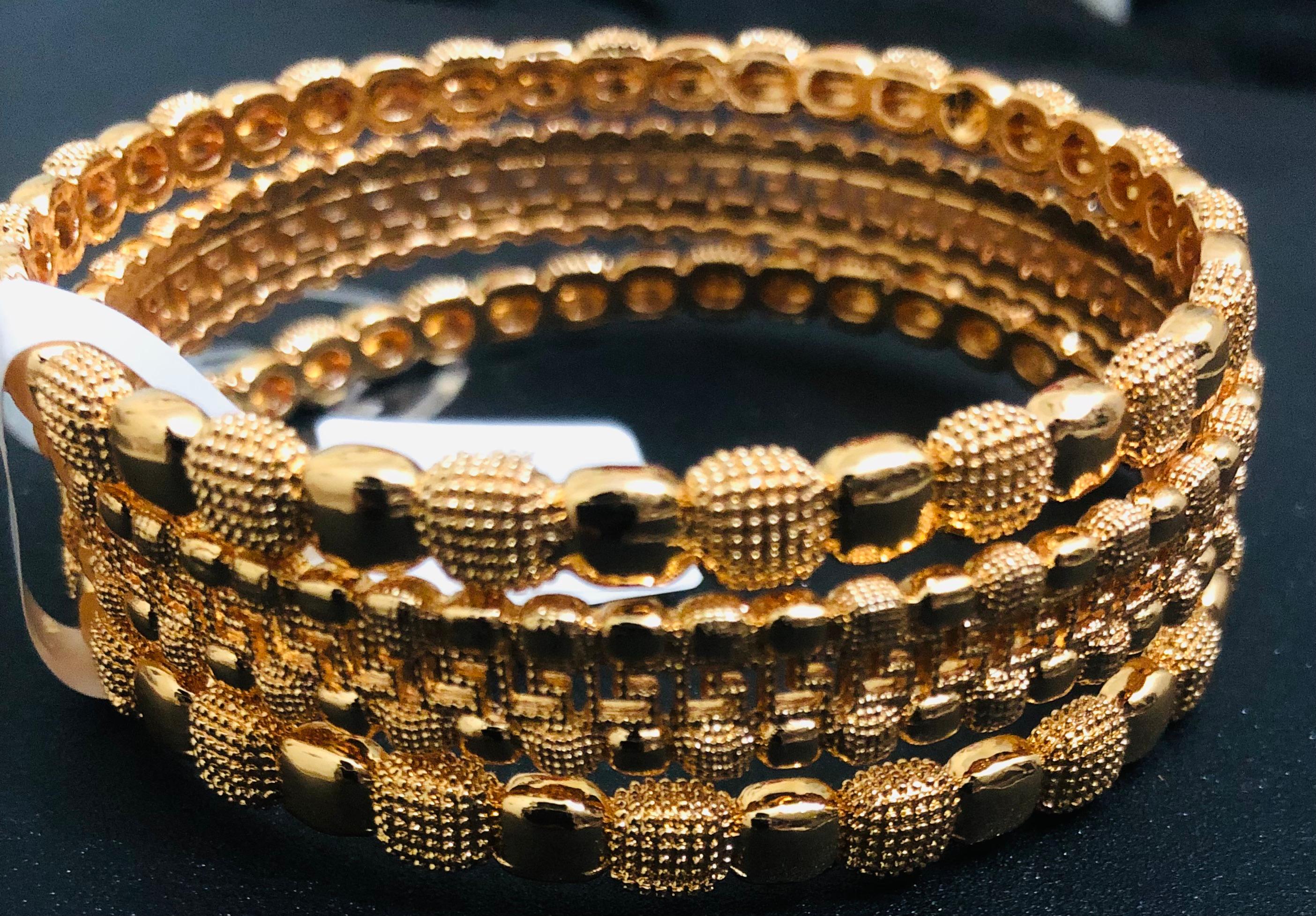 Four-Piece Gold-Tone Stacked Bangle Jewelry Set (Beaded & Textured)