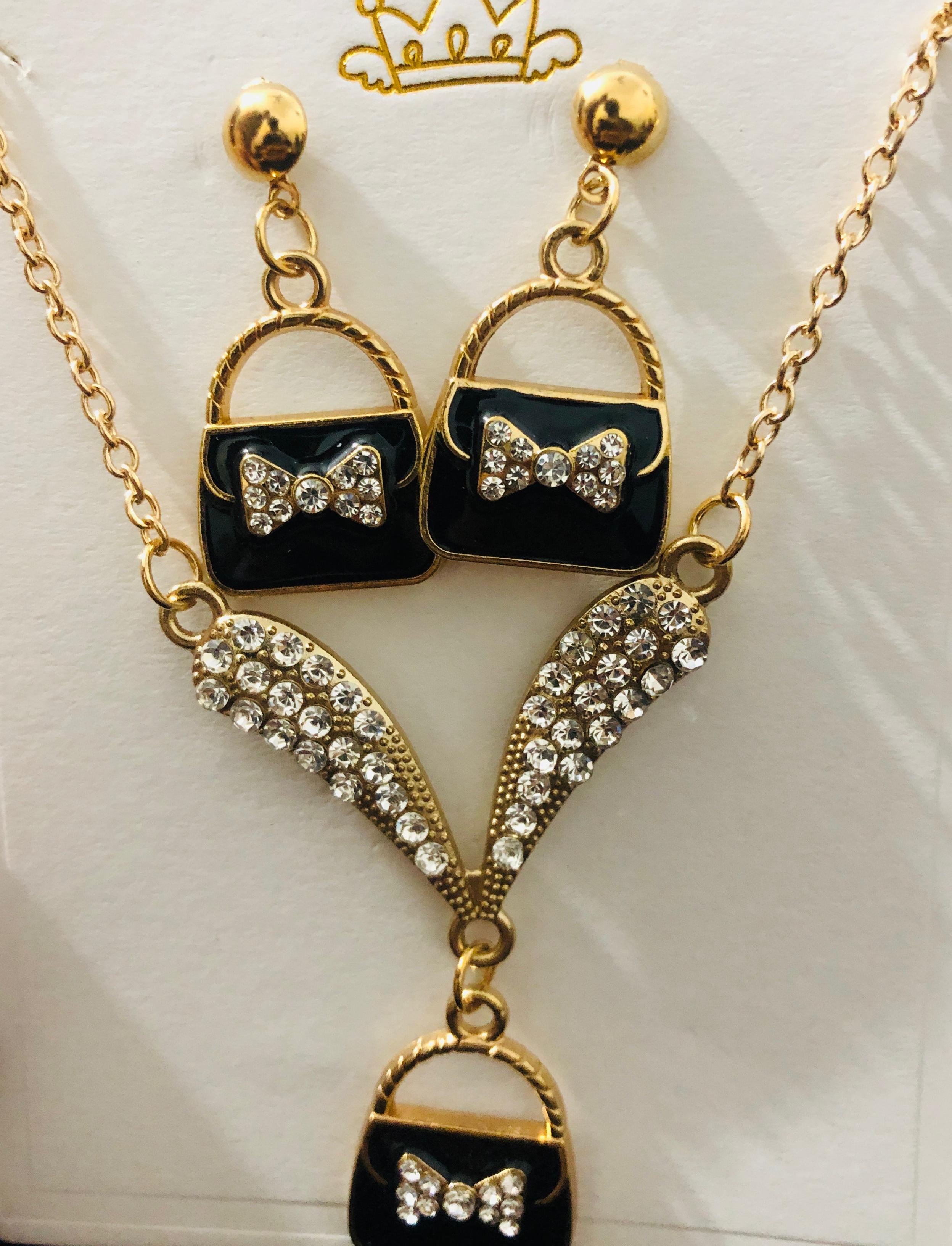 Chic Purse Pendant Jewelry Set - Gold Tone Necklace and Dangle Earrings with Crystal Bow Accent