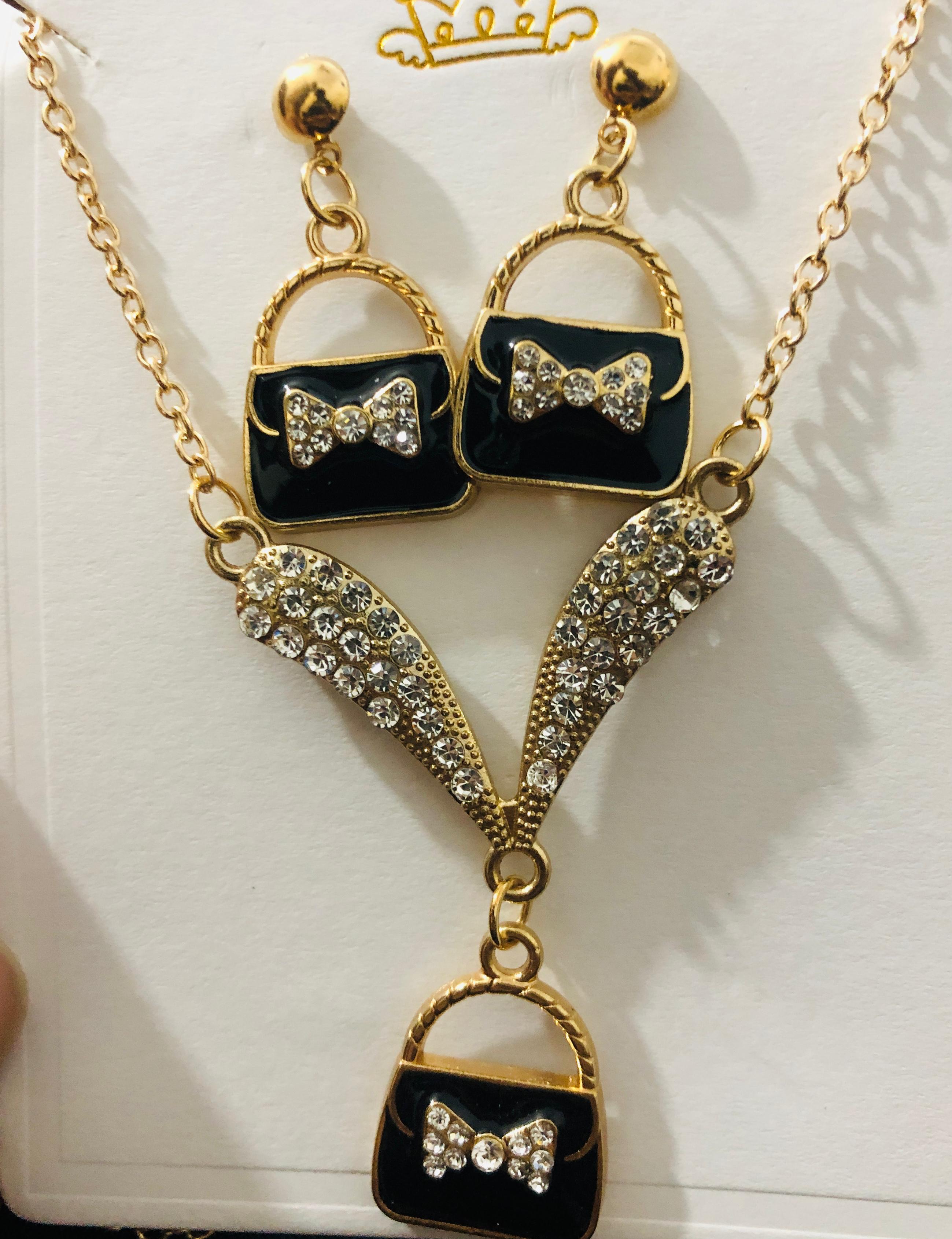 Chic Purse Pendant Jewelry Set - Gold Tone Necklace and Dangle Earrings with Crystal Bow Accent